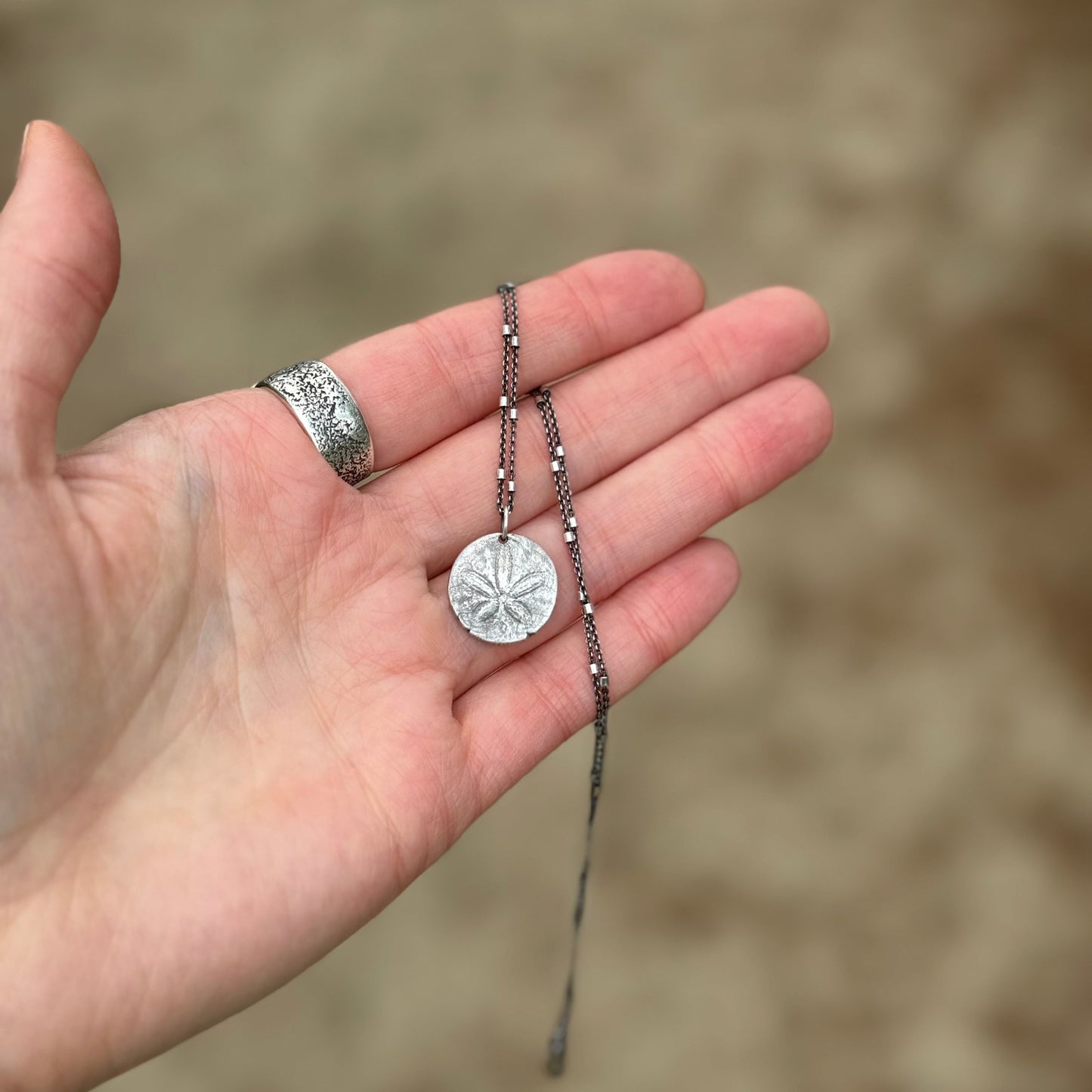 She Holds the Tide – Oregon Coast Sand Dollar Pendant
