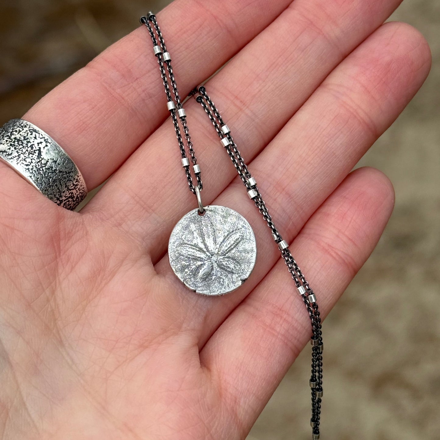She Holds the Tide – Oregon Coast Sand Dollar Pendant