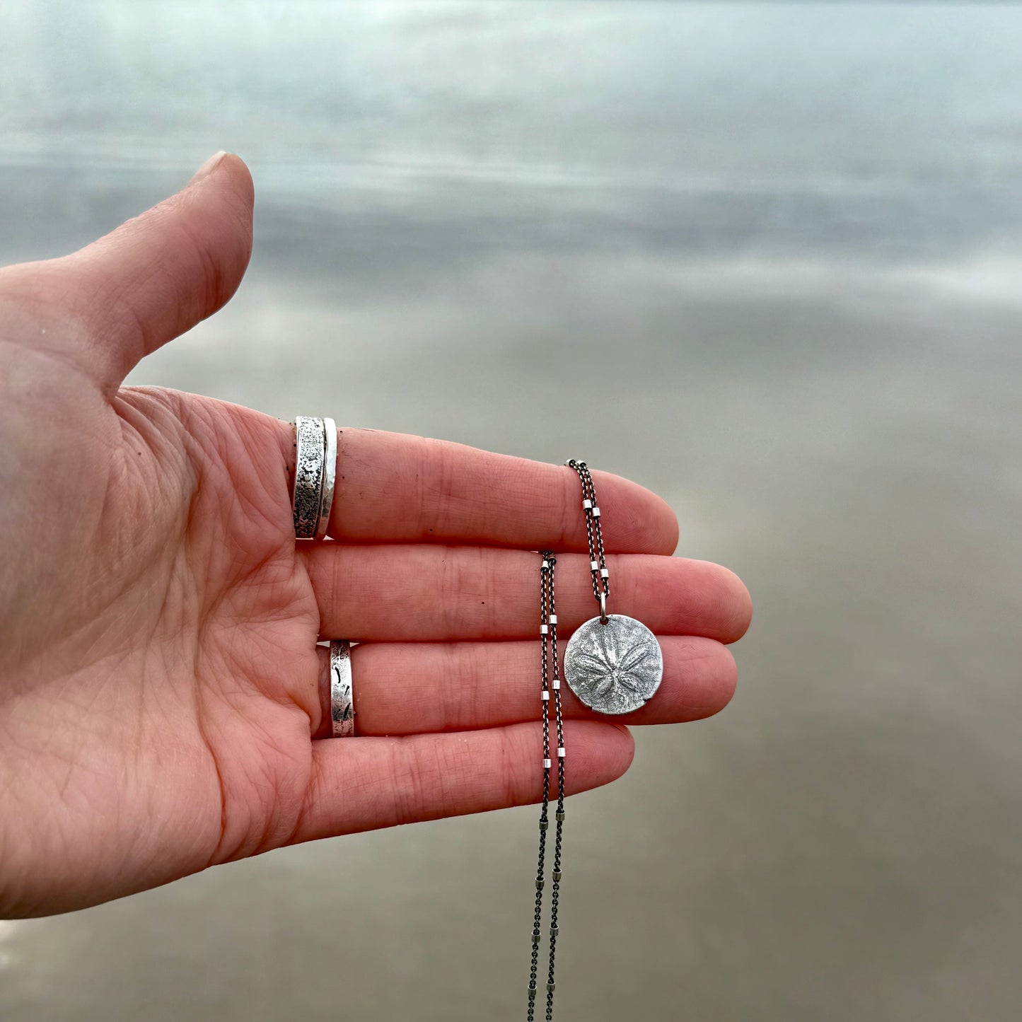 She Holds the Tide – Oregon Coast Sand Dollar Pendant