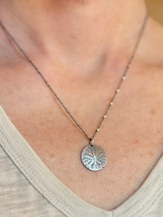 She Holds the Tide – Oregon Coast Sand Dollar Pendant